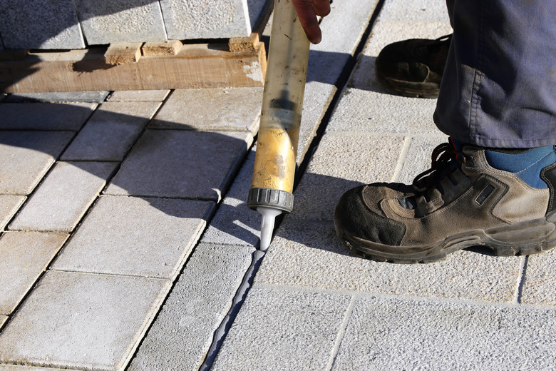 Pavement works by construction worker.