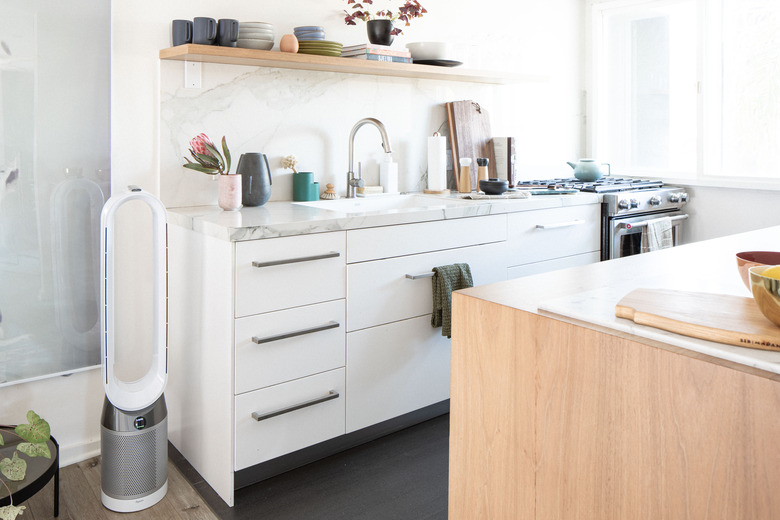 small Hunker House kitchen with faucet, sink, and gas stove and oven