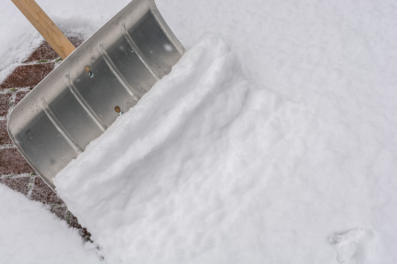 Walkway is cleared of snow after a snowfall with a snow shovel