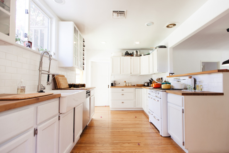 White kitchen with hardwood floors