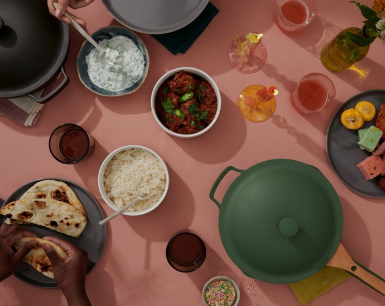 pans and food on pink background