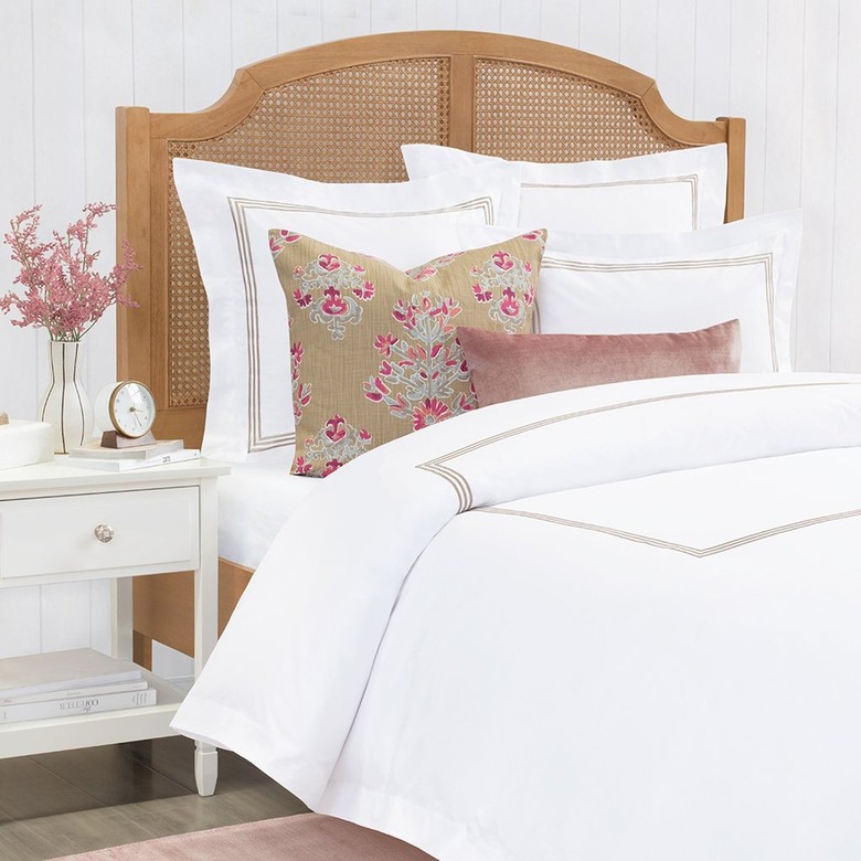 white bedding with accent pillows