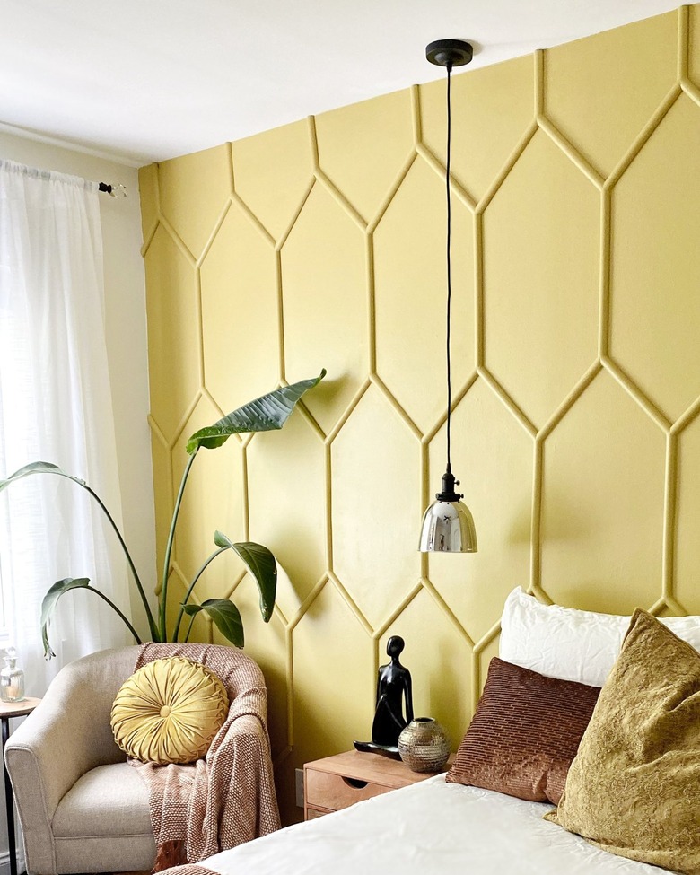 yellow accent wall in guest bedroom