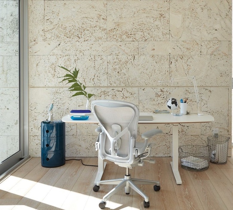 desk space with white furniture and blue side table