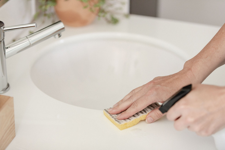 Cleaning bathroom sink area