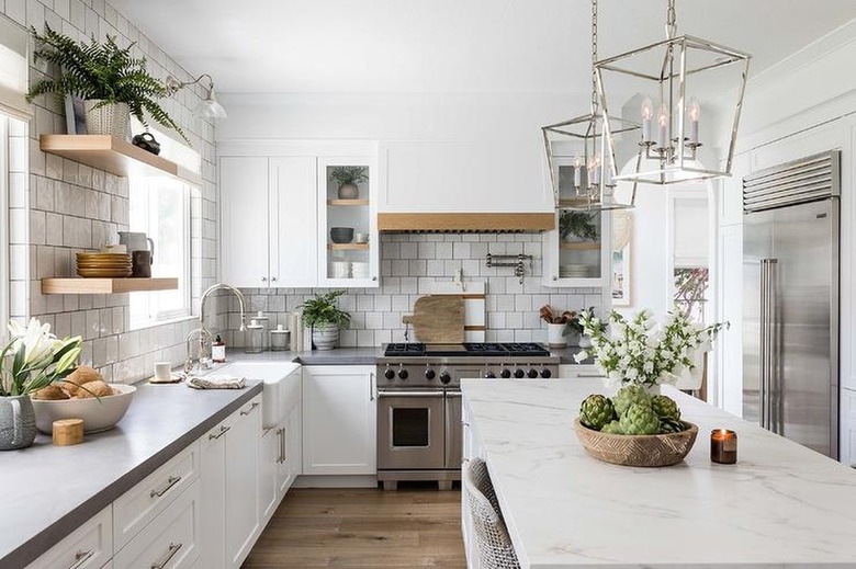 white kitchen with stainless steel appliances