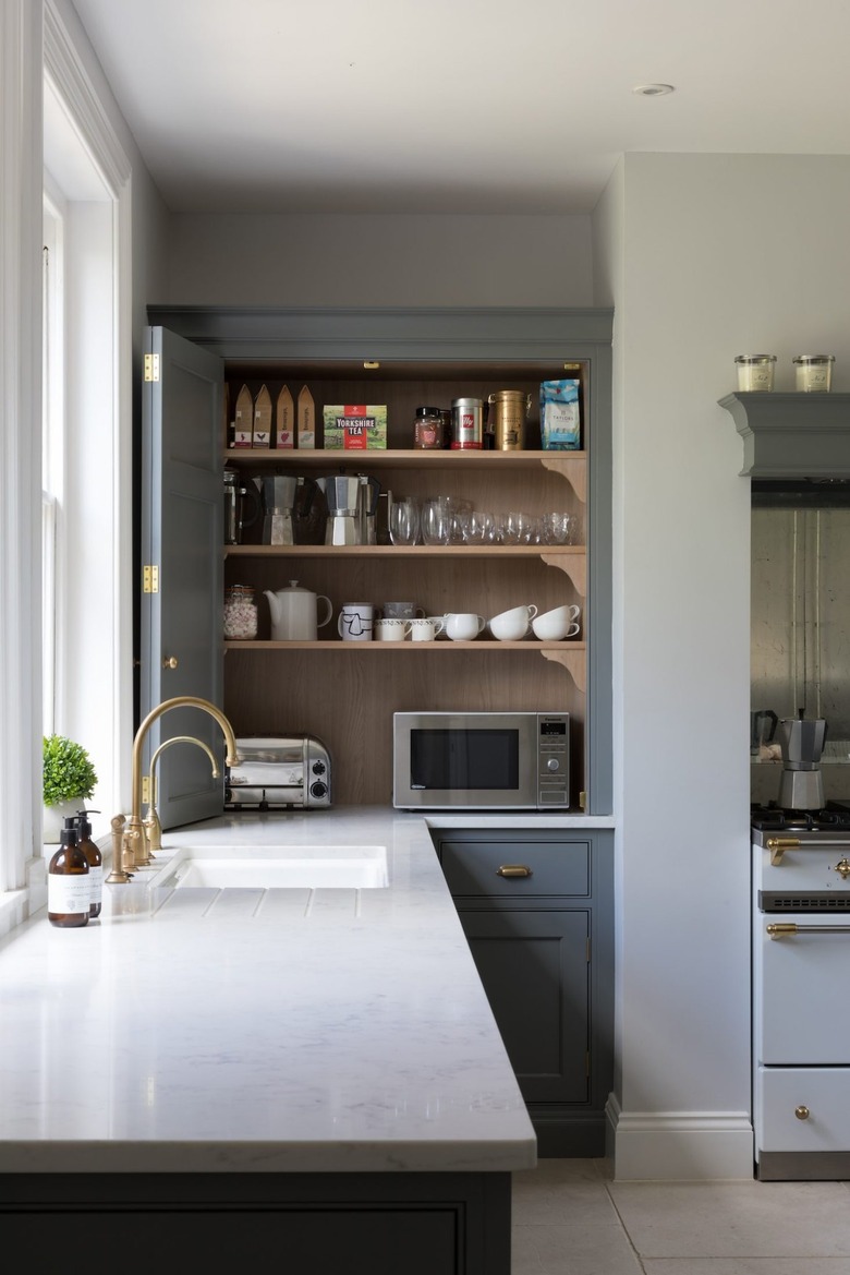 appliance garage with bifold doors in alcove of classic kitchen