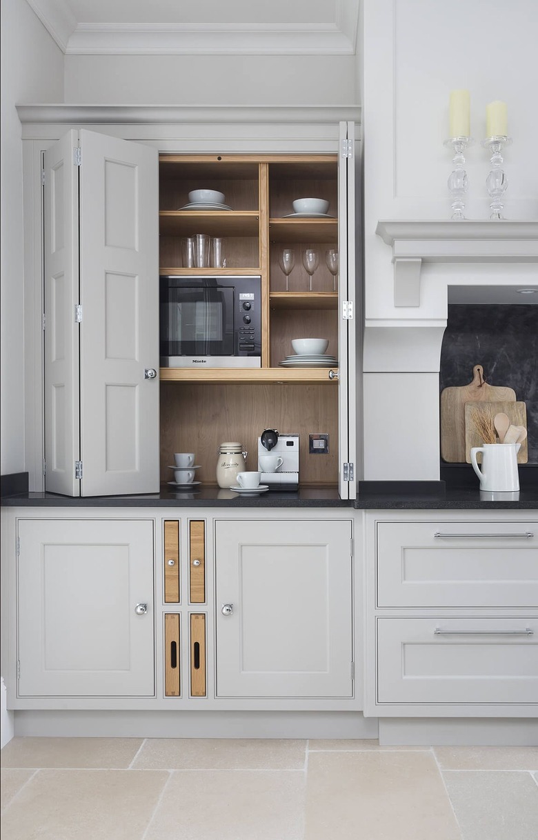 appliance garage with bifold doors and cubby holes