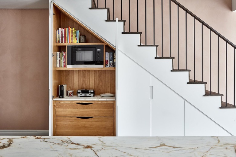 appliance garage under the stairs with microwave