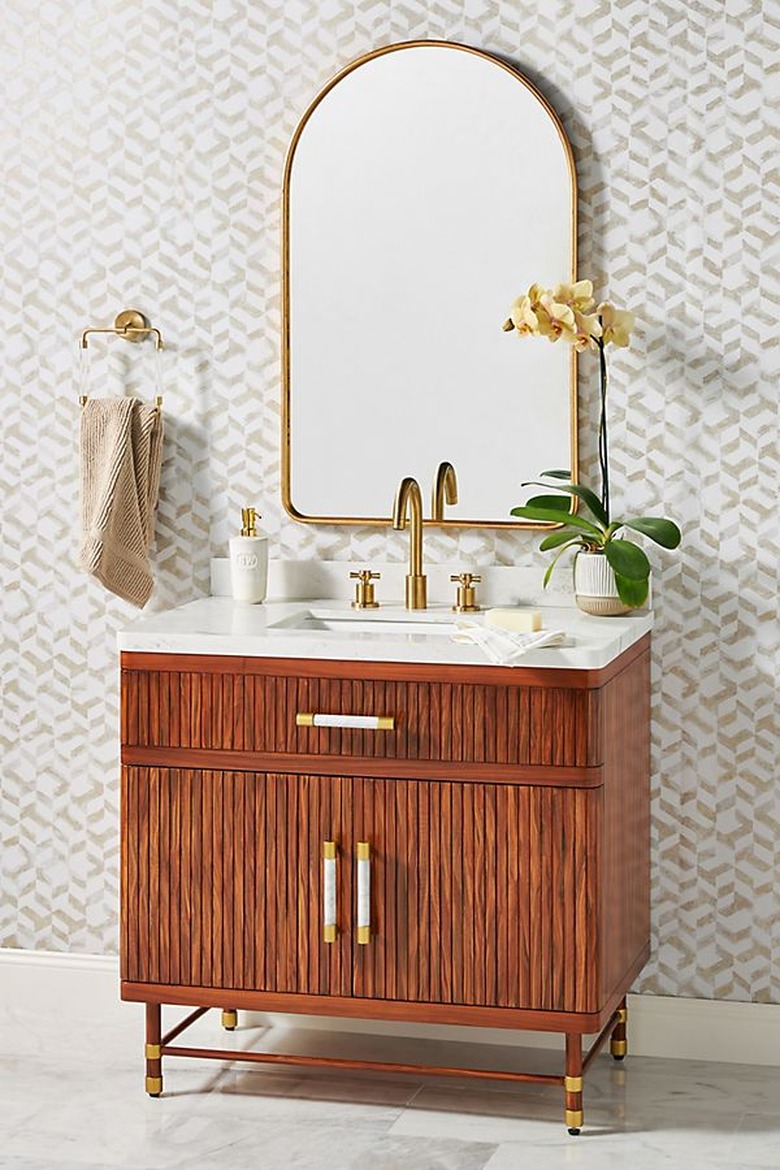 art deco apartment bathroom with wooden vanity and mirro