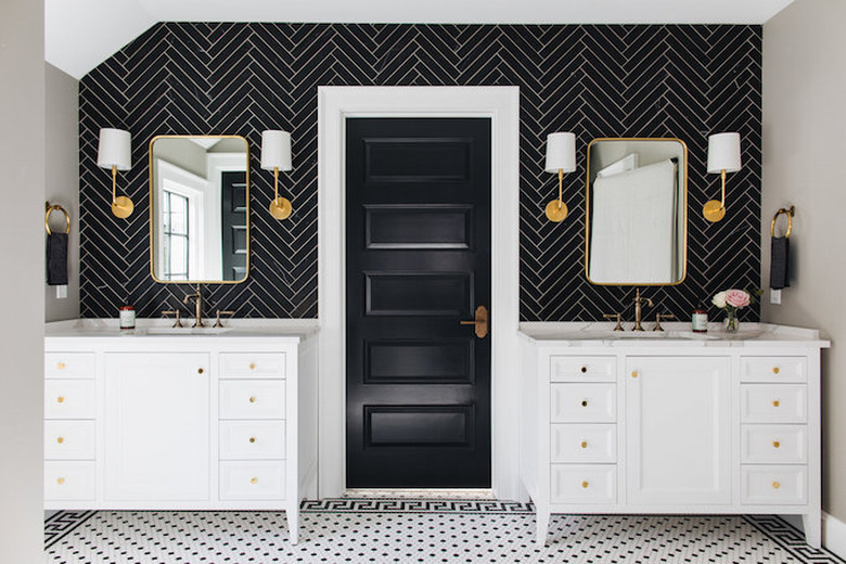 Modern, minamlist bathroom with black herringbone pattern wall tiles