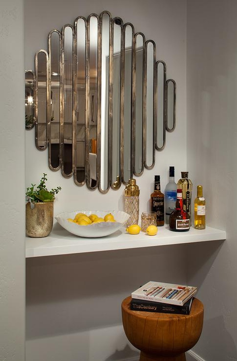 art deco decorating on a budget mirror over bar with wood stool