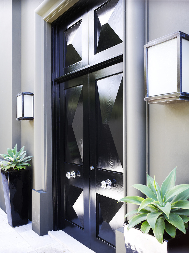 Art deco door in glossy black paint and geometric details