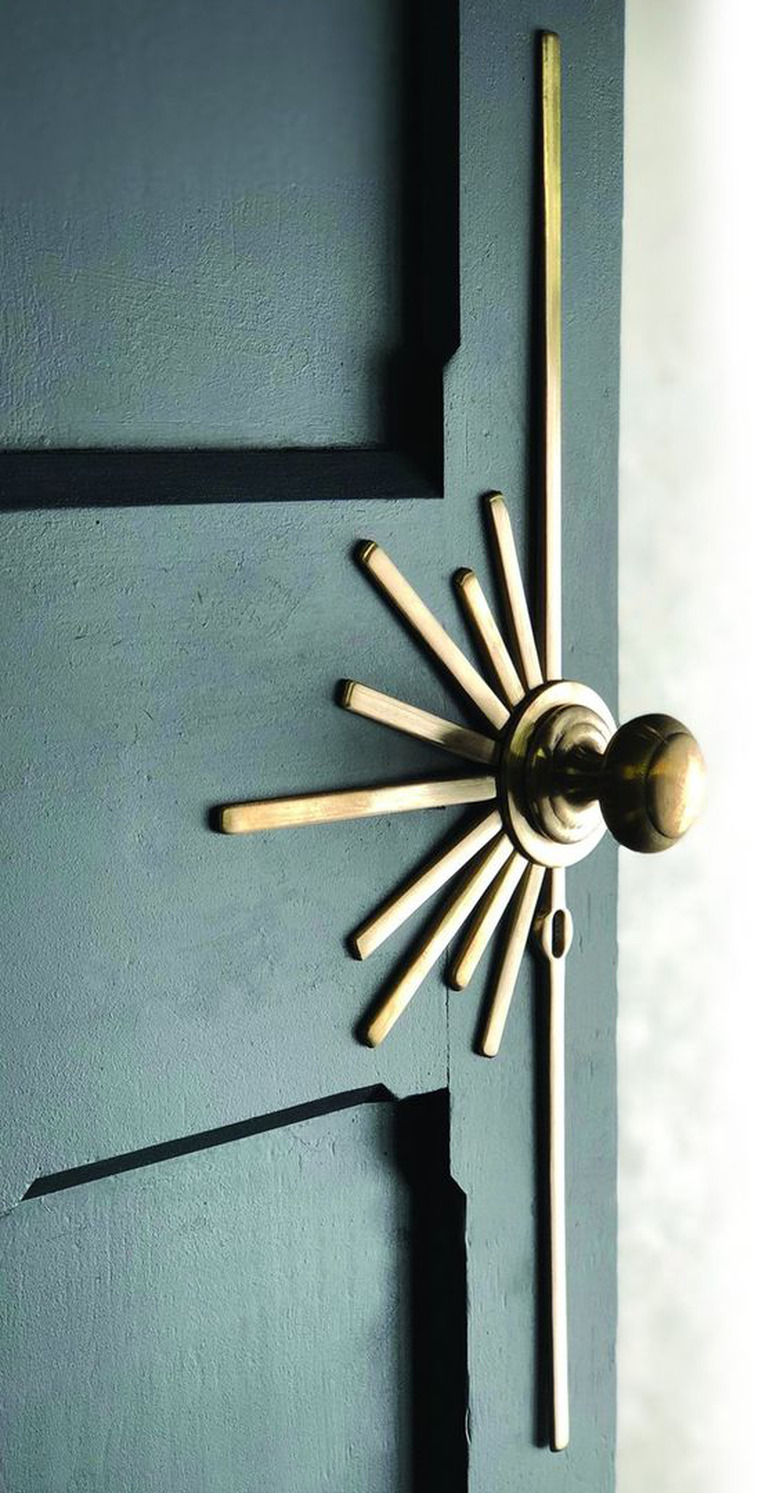 Art deco door in green with brass sunburst hardware