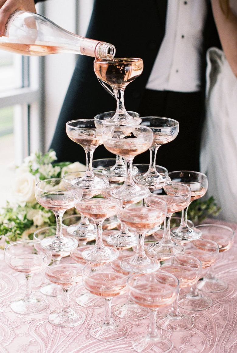 art deco themed party idea with champagne glass tower