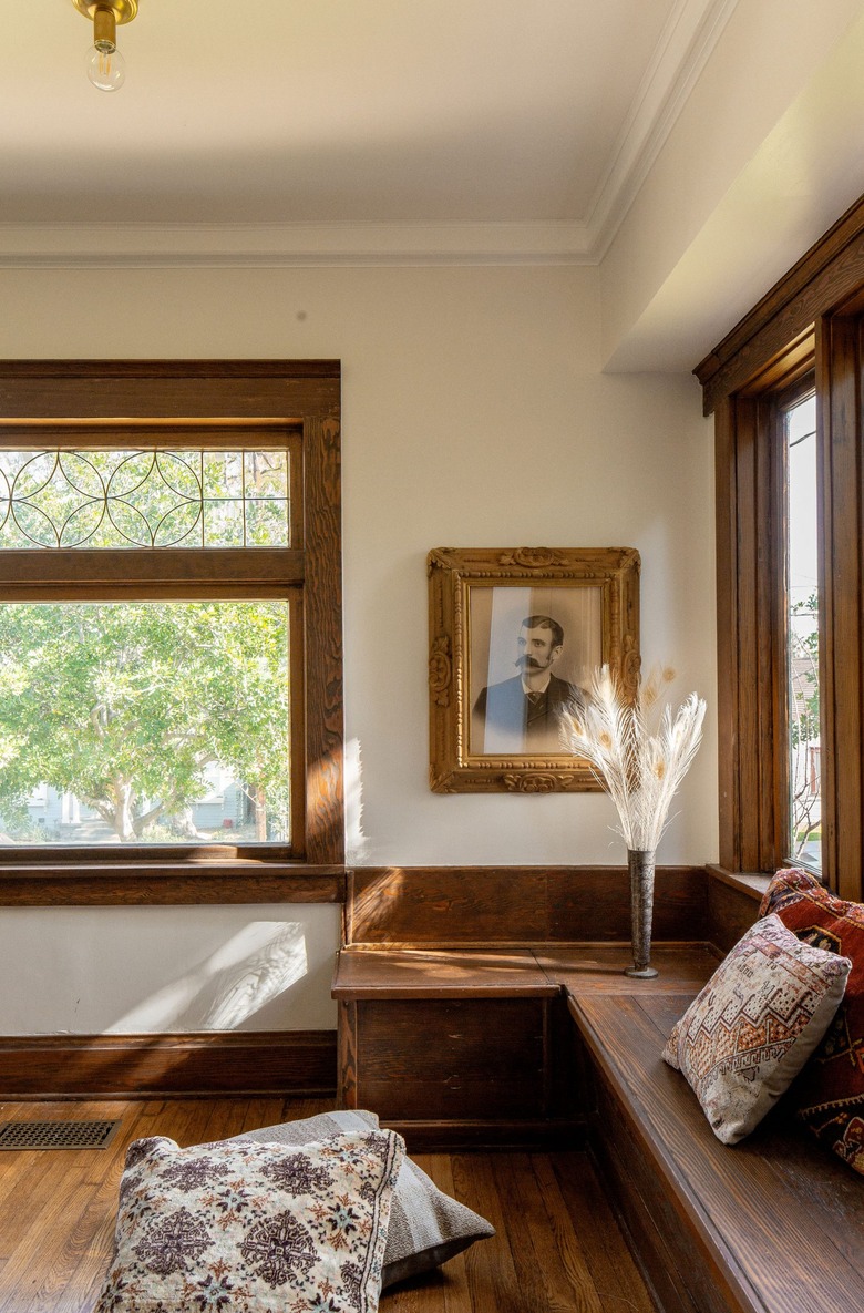 arts and crafts interior with wooden windows and floors and wooden bench