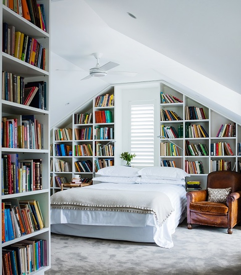 Attic Bedroom Furniture with bookshelves and ceiling fan by Mr. Waller