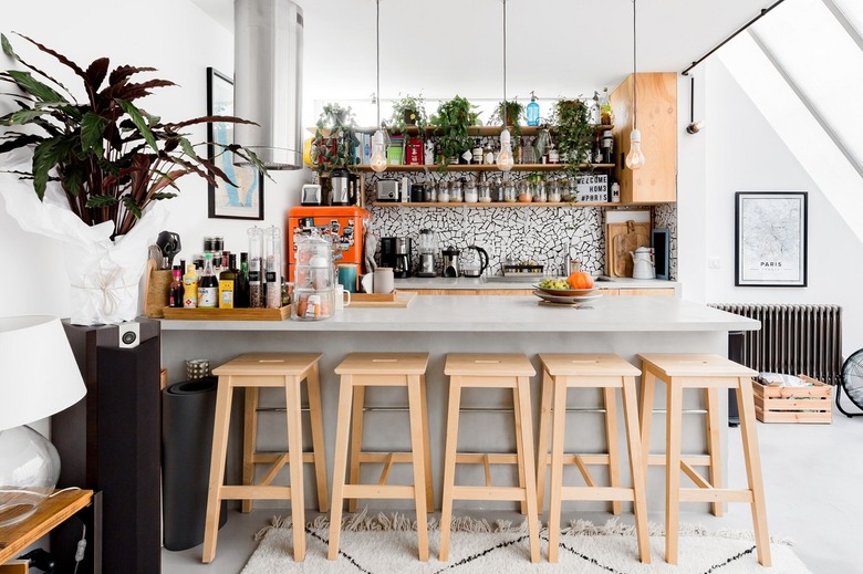 white attic kitchen with island and stools