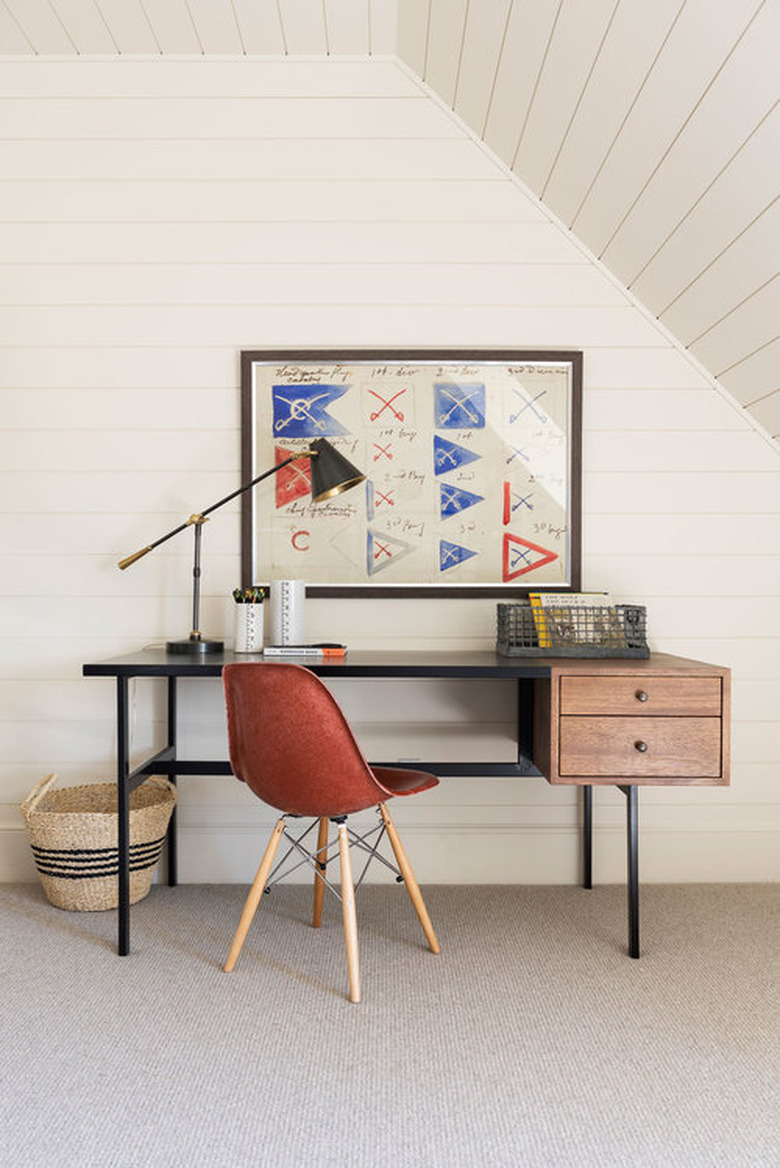 attic playroom with homework desk and red chair