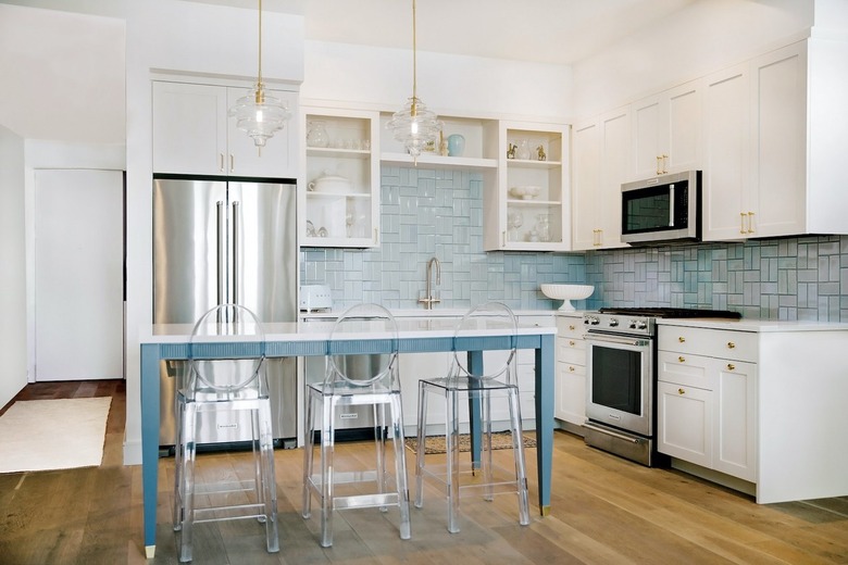 Blue backsplash with white cabinets