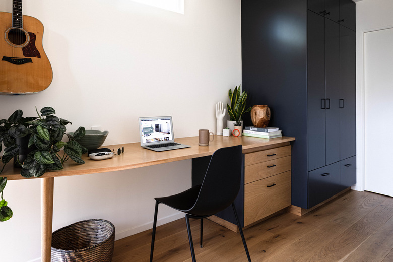 modern office space with white walls and hardwood floors