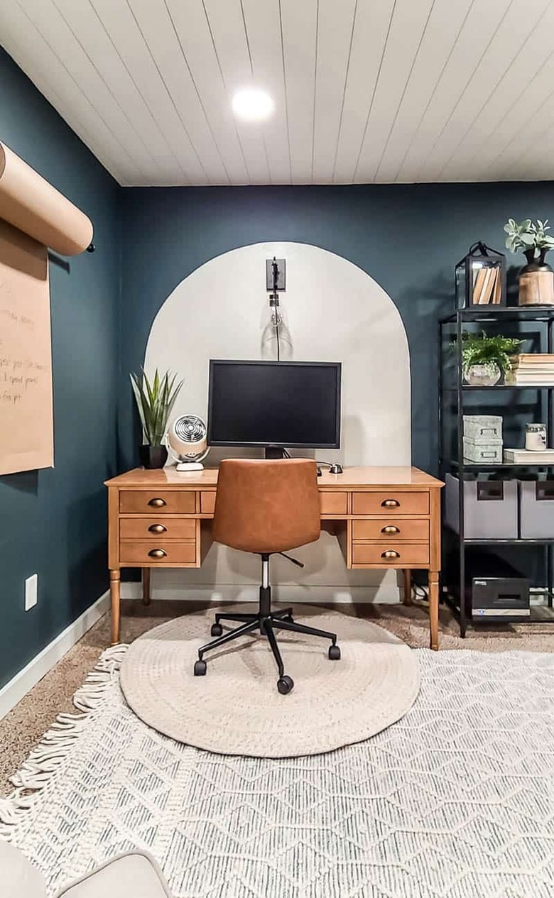 bohemian basement office with painted wall arch and shiplap ceiling