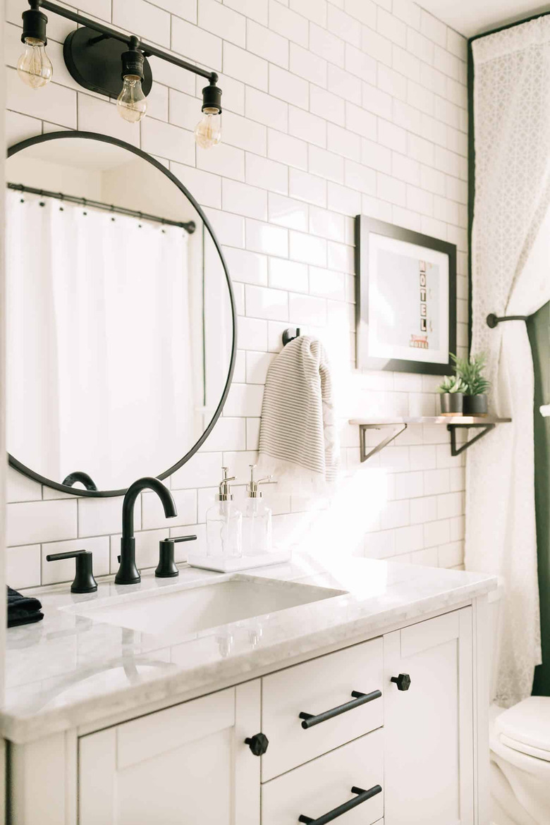 white subway ceramic tile on bathroom wall