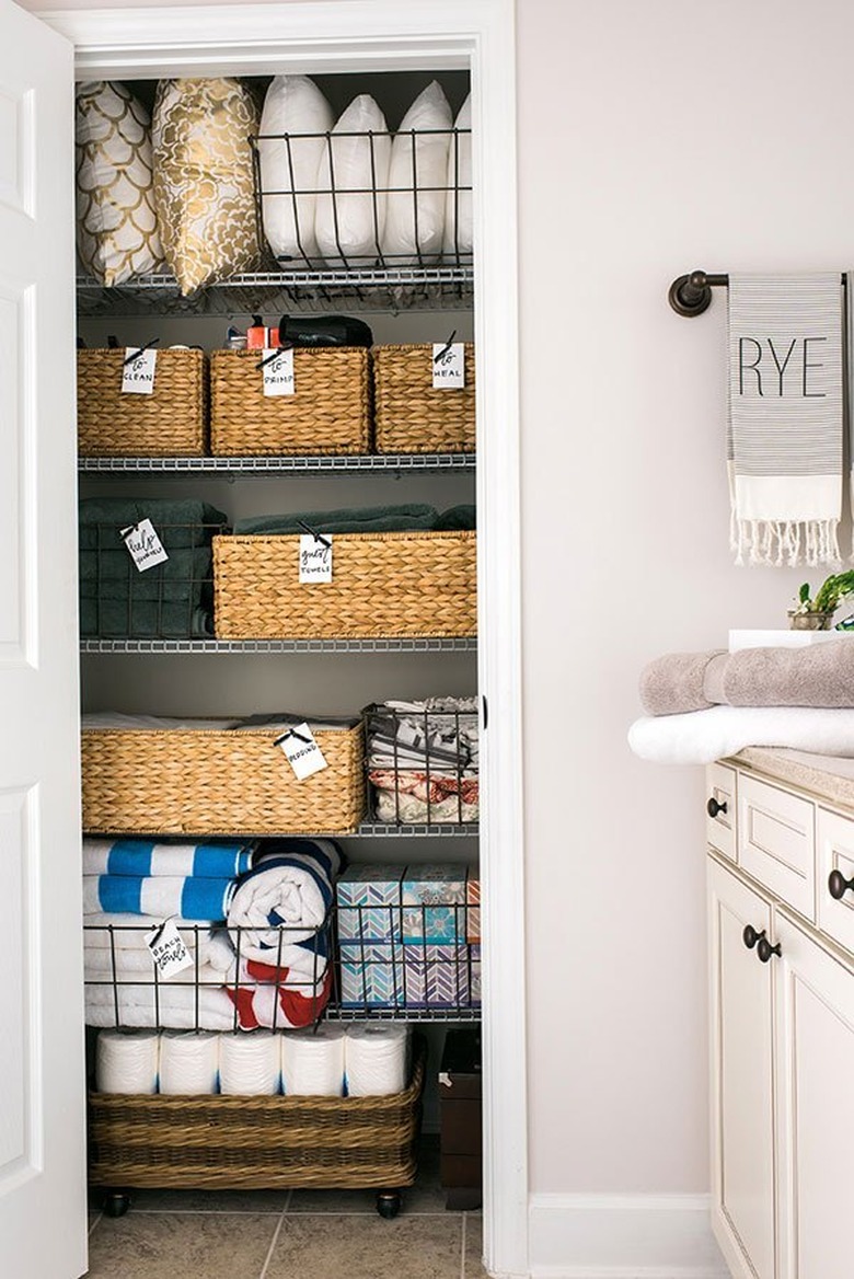 bathroom closet organization with baskets