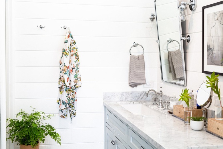 white shiplap paneling on bathroom walls