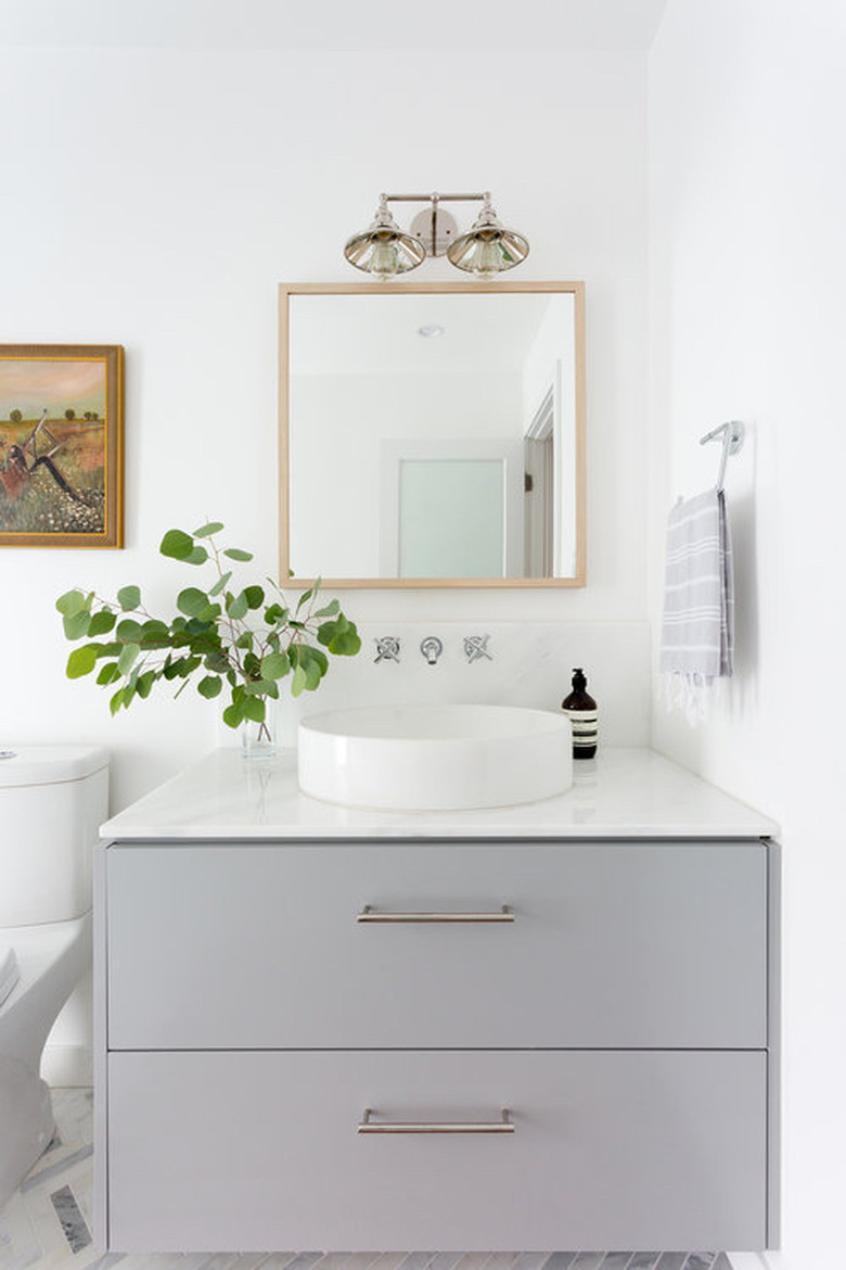 white bathroom with gray vanity cabinet