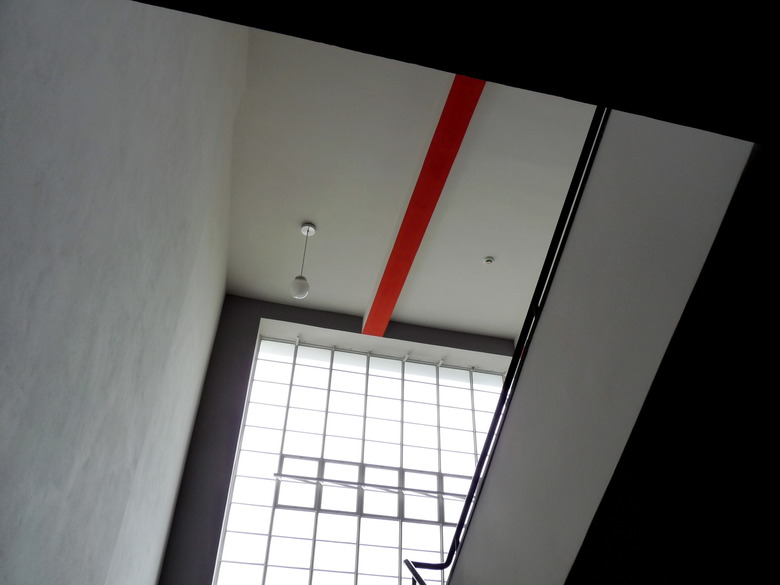 Bauhaus architecture with modern interior seen in globe ceiling light and square shapes in windows