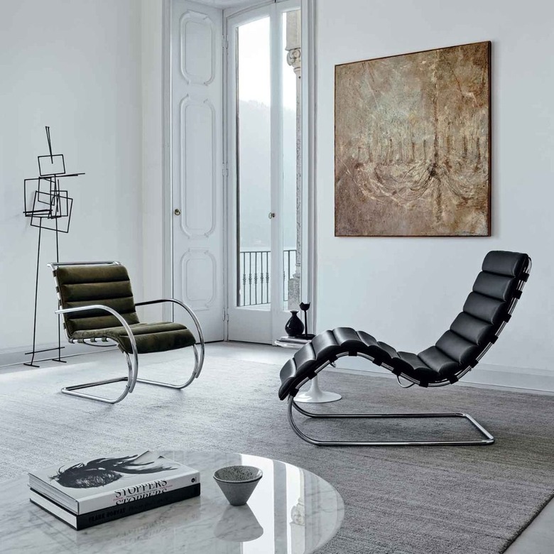 Bauhaus style room with modern chairs and contemporary sculpture