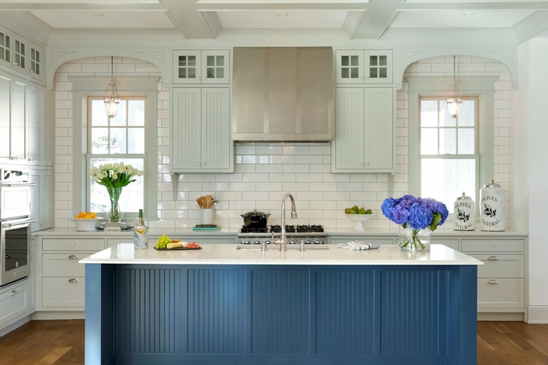 blue beadboard kitchen island with white countertop