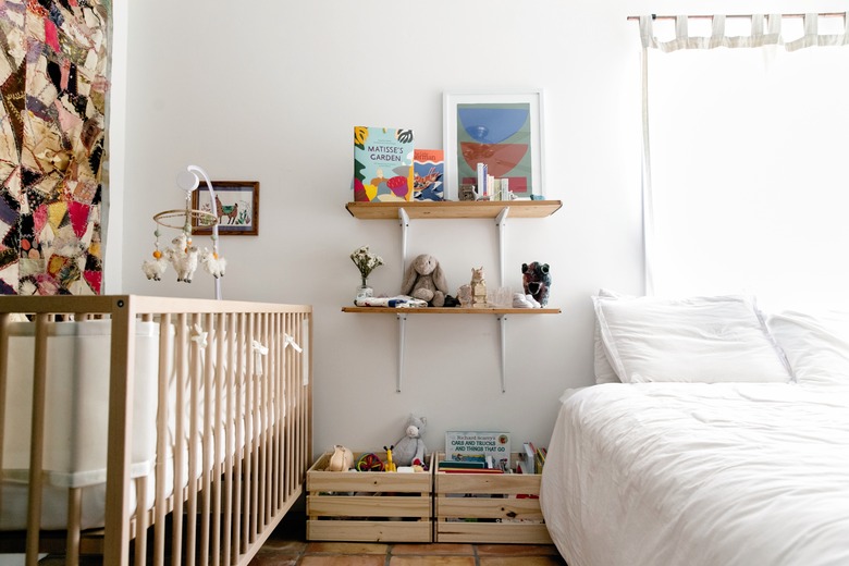 Bed and crib in bedroom