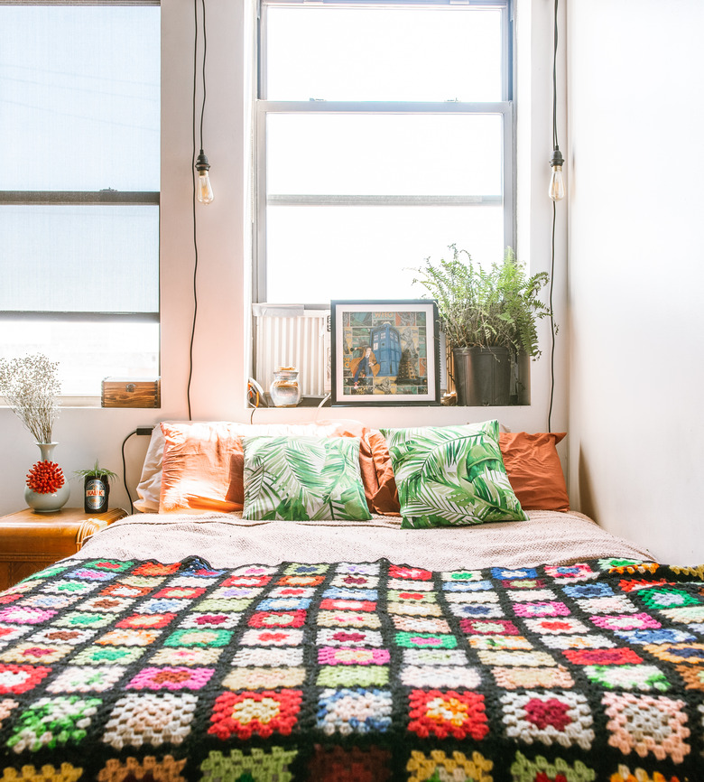 Patchwork blanket on bed