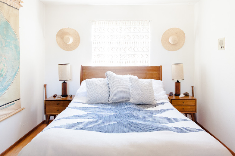 Minimalist California bedroom with map on wall.