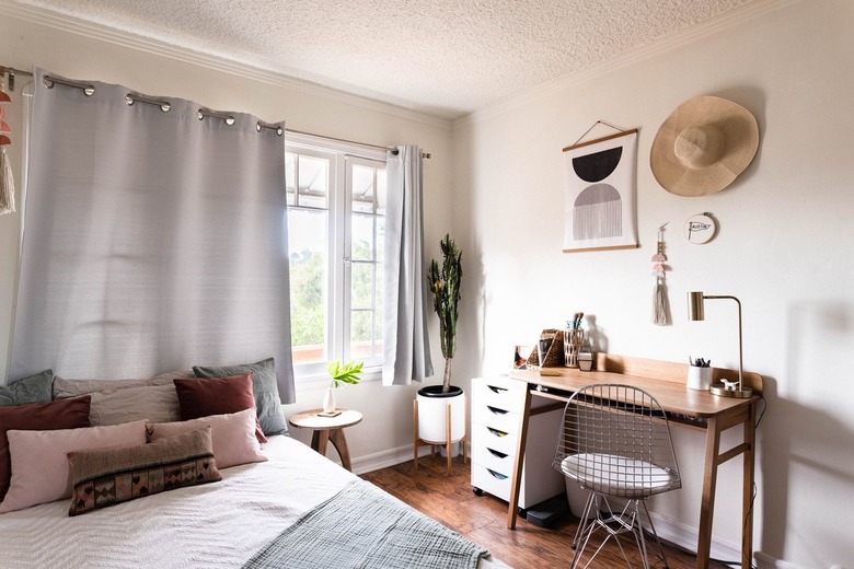 Minimalist bedroom with an office desk and gray-beige accents