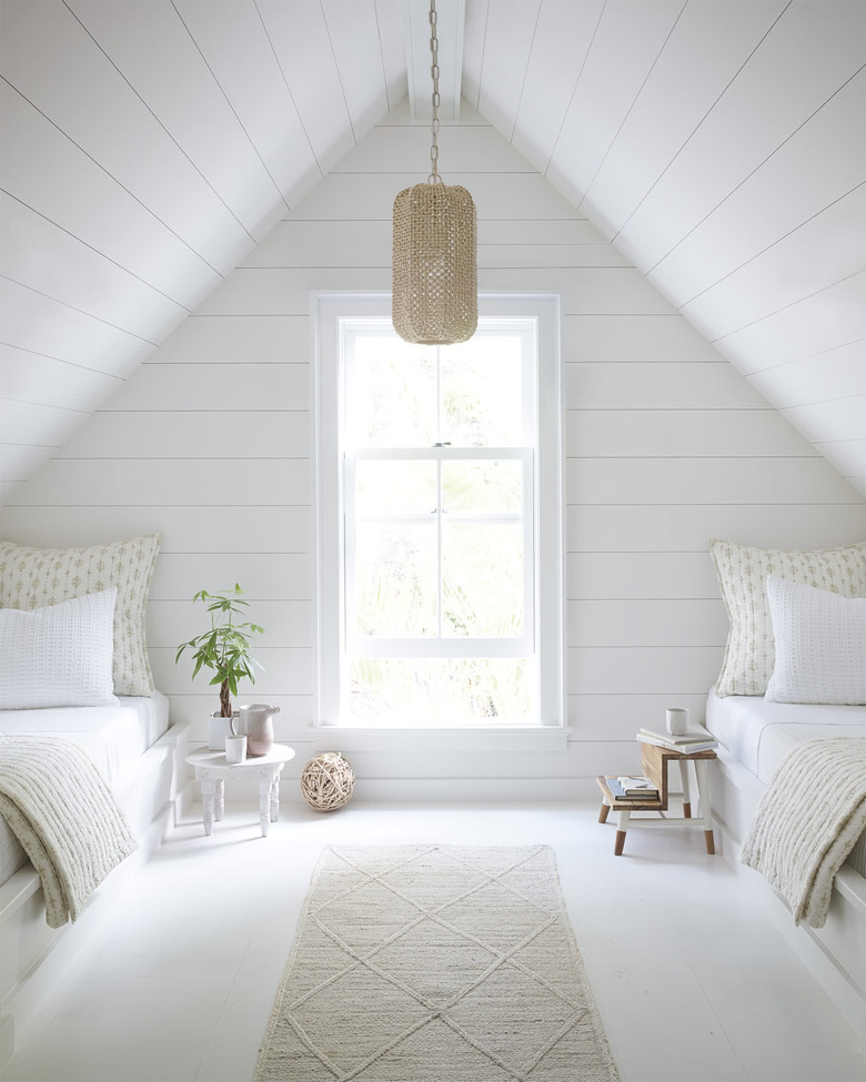 bedroom lighting idea with pendant hanging in the middle of white room