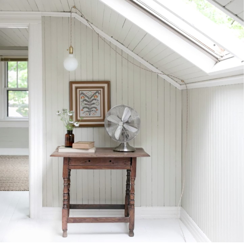 bedroom lighting idea with plug in pendant light hanging in nook over small table