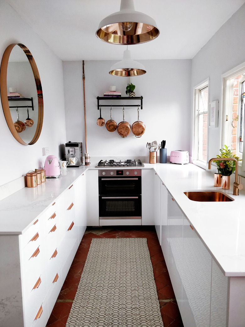 kitchen makeover with white kitchen cabinets and copper accents