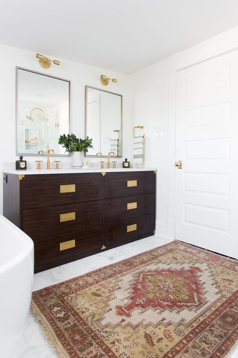 campaign style dresser as bathroom vanity idea with area rug on floor