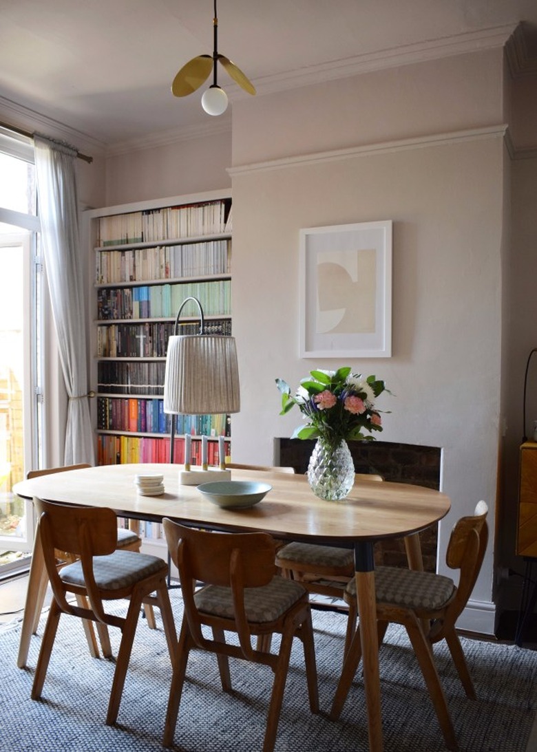 two tone beige color dining room with wooden dining table