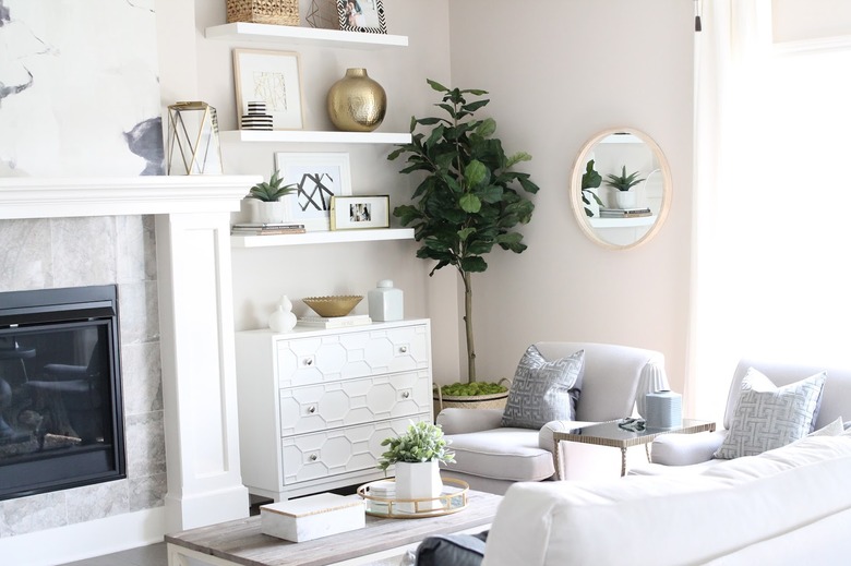 beige color living room with white furniture and gray sofa