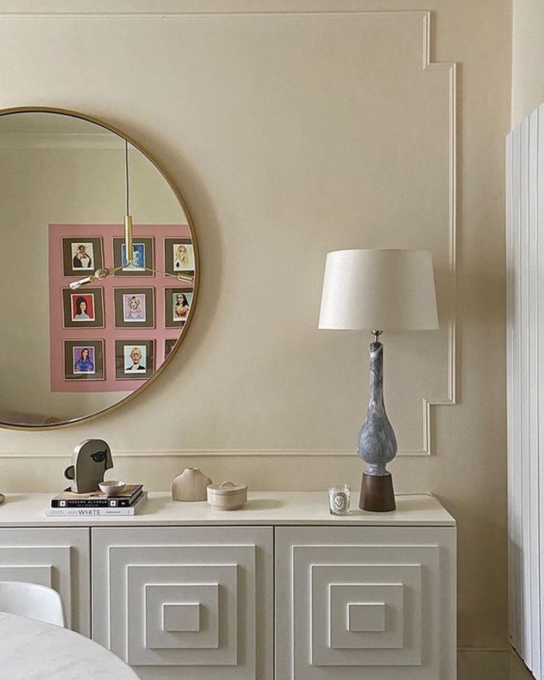 beige color paneled wall with white console