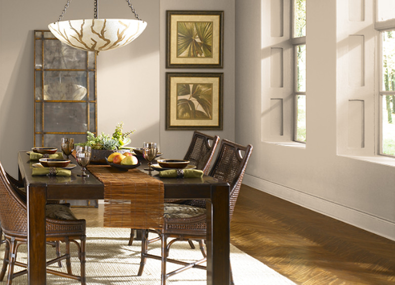 dining room space with beige walls and dark chairs