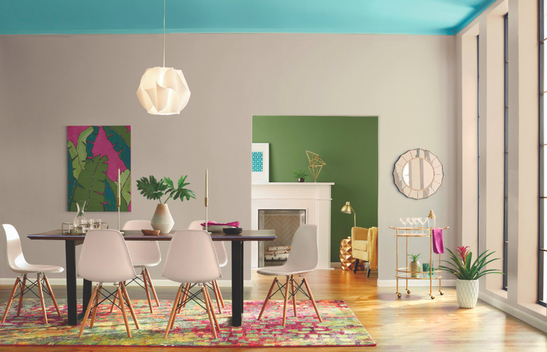 dining room space with beige walls and blue ceiling