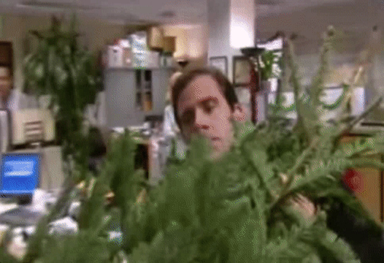 GIF from The Office showing a man with Christmas tree