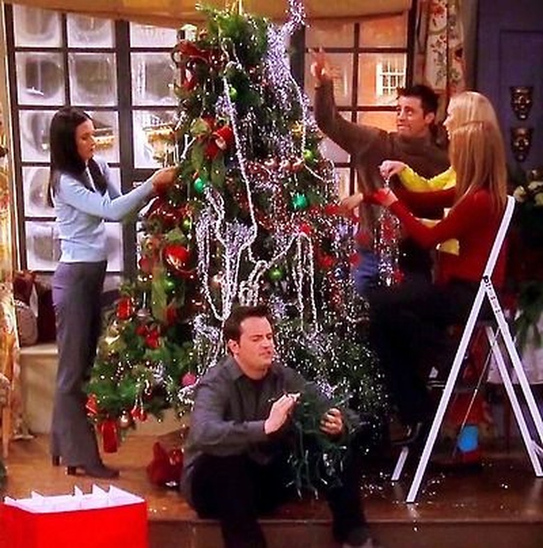 scene from Friends show with figures decorating a Christmas tree