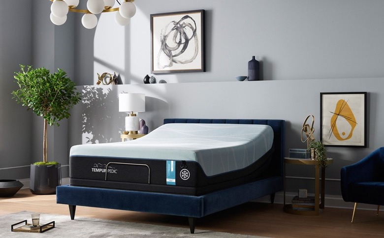 Mattress on blue bed frame