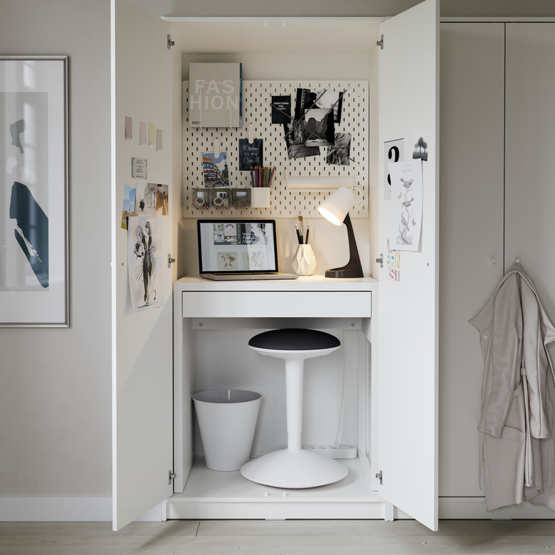 IKEA micke desk in closet with stool and pin board